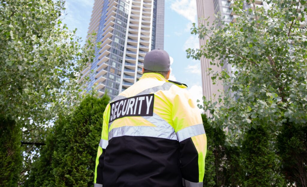 Security guard in uniform patrolling a residential area.